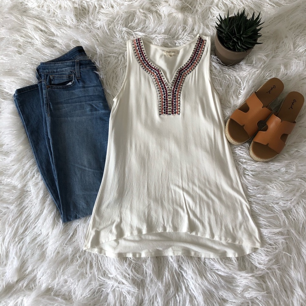 Long, white, embroidered tank top.